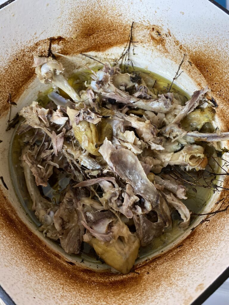 Chicken Bones and drippings in dutch oven before adding water