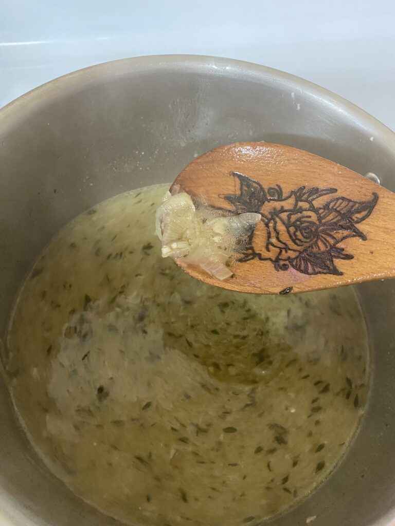 Gorgeous french onion soup ready to be poured into ramekins and topped with bread and cheese 